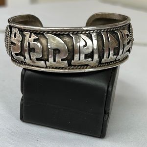 Vintage Silvertone Om Mani Padme Hum cuff bracelet